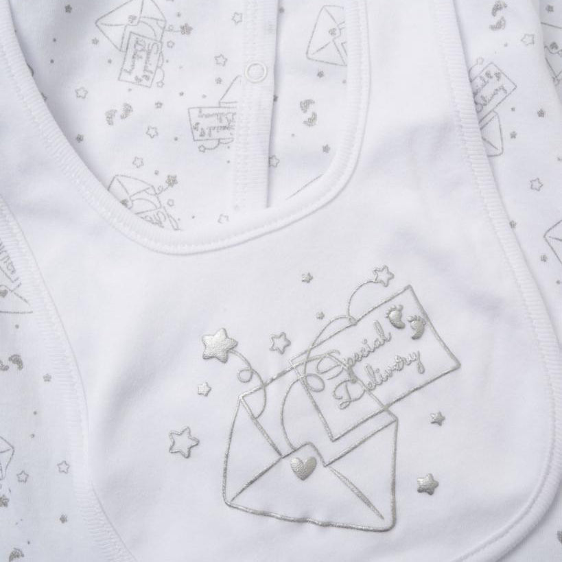 White baby bib with embroidered design and text 'special delivery' on a clothing set. 