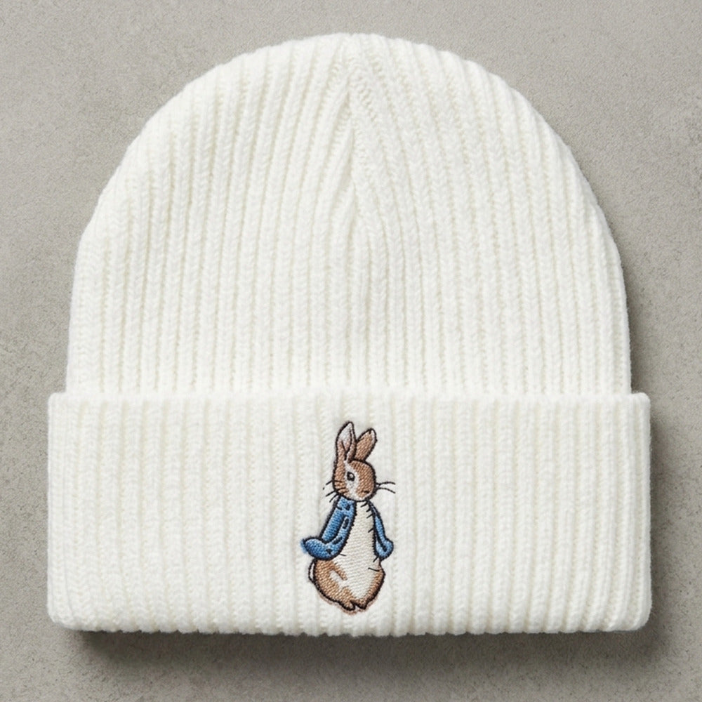 White baby hat with blue bunny detail for newborn to 3 months