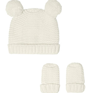 White pom-pom baby hat and two matching mittens shown against a plain background.