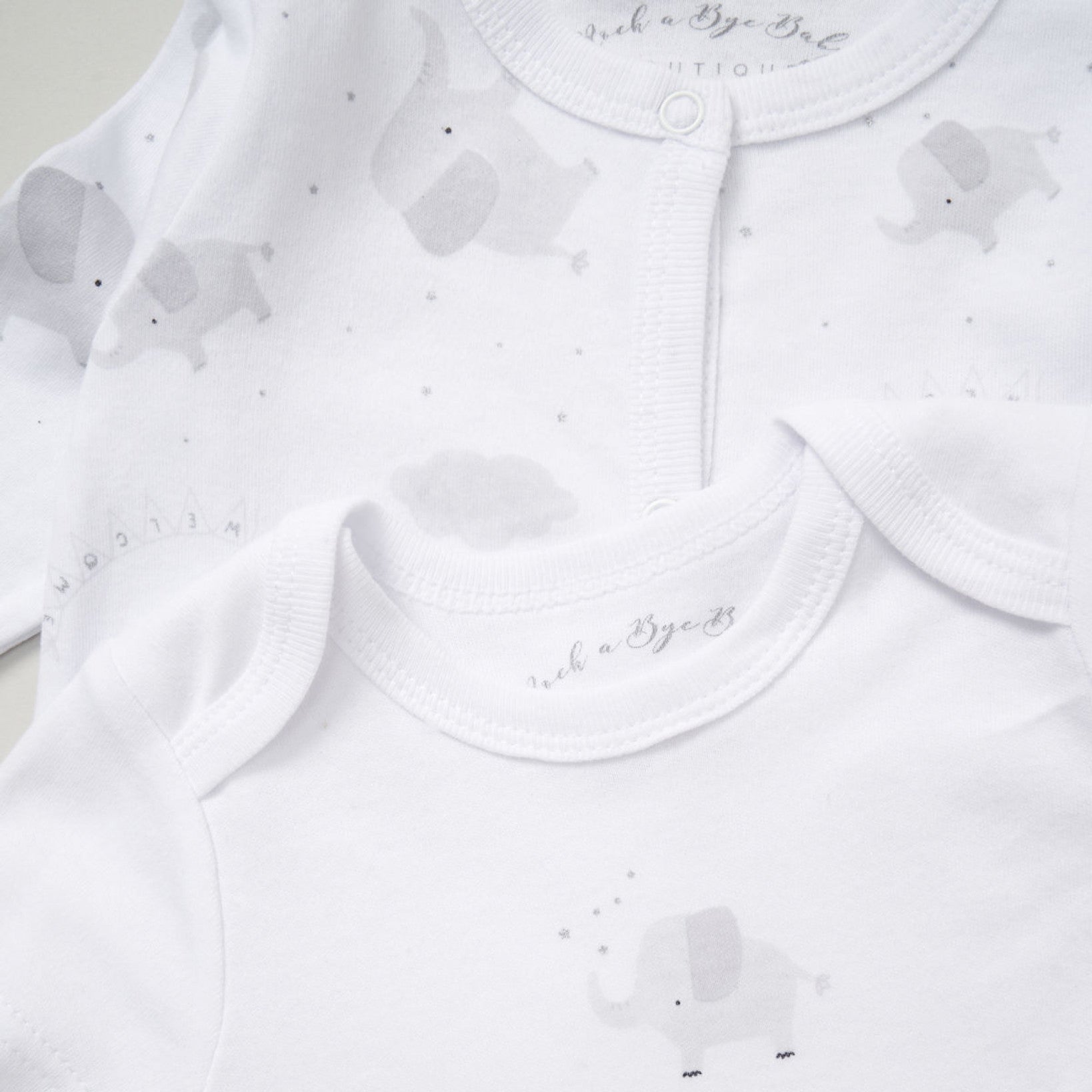 White short sleeve bodysuit with small grey elephant motif