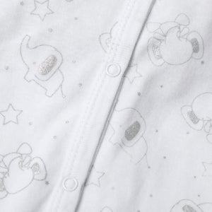 Close-up of cotton sleepsuit with silver elephant print