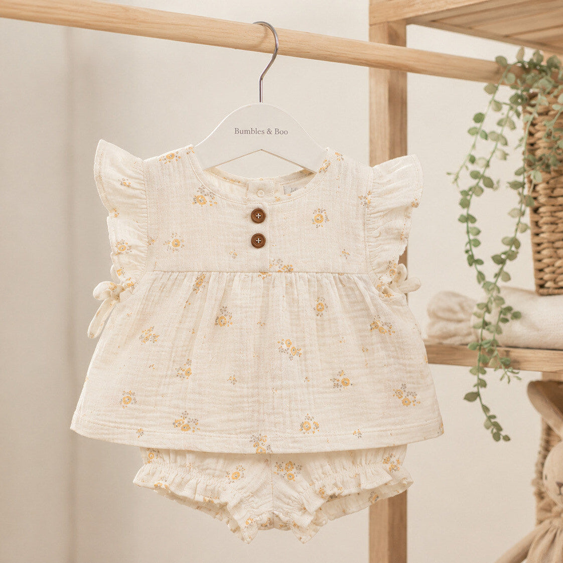 White floral baby girl outfit with frill sleeve cotton top and matching shorts