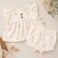 White floral baby girl outfit with frill sleeve top and matching shorts
