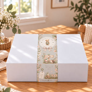 A white rectangular gift box with a decorative bumbles and boo belly wrap