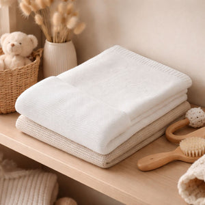 A white organic knit baby blanket