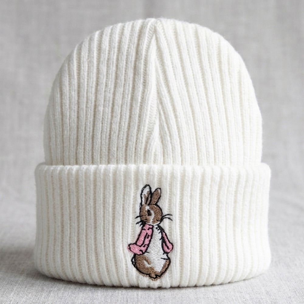 White knitted baby hat with pink embroidered bunny detail for newborns 0-3 months
