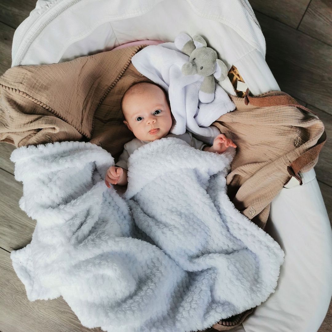 white waffle baby blanket and elephant comforter soft toy