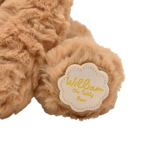 William the brown bear label on 
paw