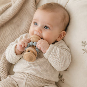 Wooden baby teething toy with pastel blue silicone beads
