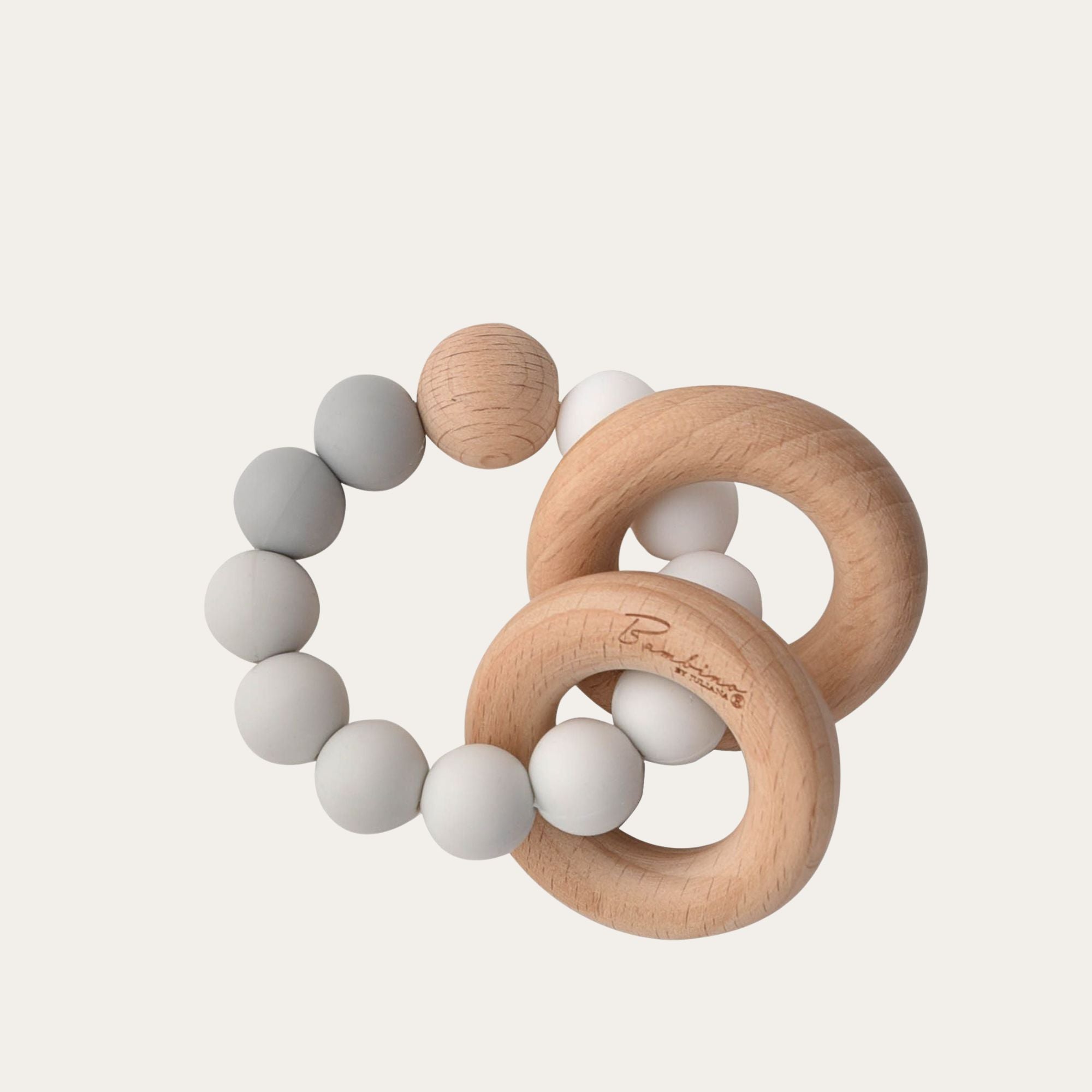 A wooden baby teether with grey & white silicone beaded ring.