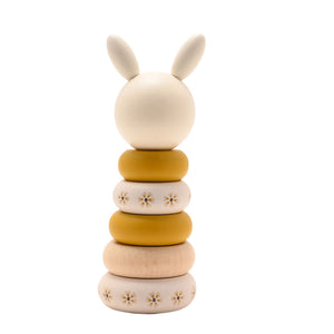 Back view of the assembled wooden bunny stacker with floral rings and plain bunny head.