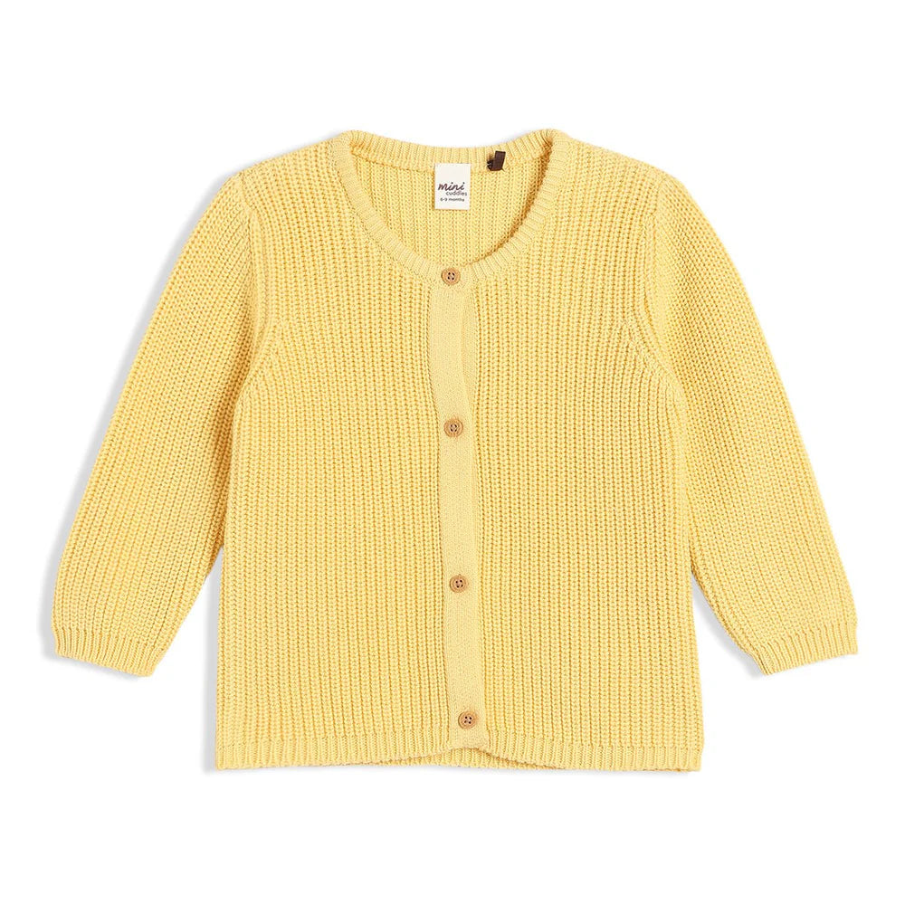 Yellow baby cardigan from a clothes set.