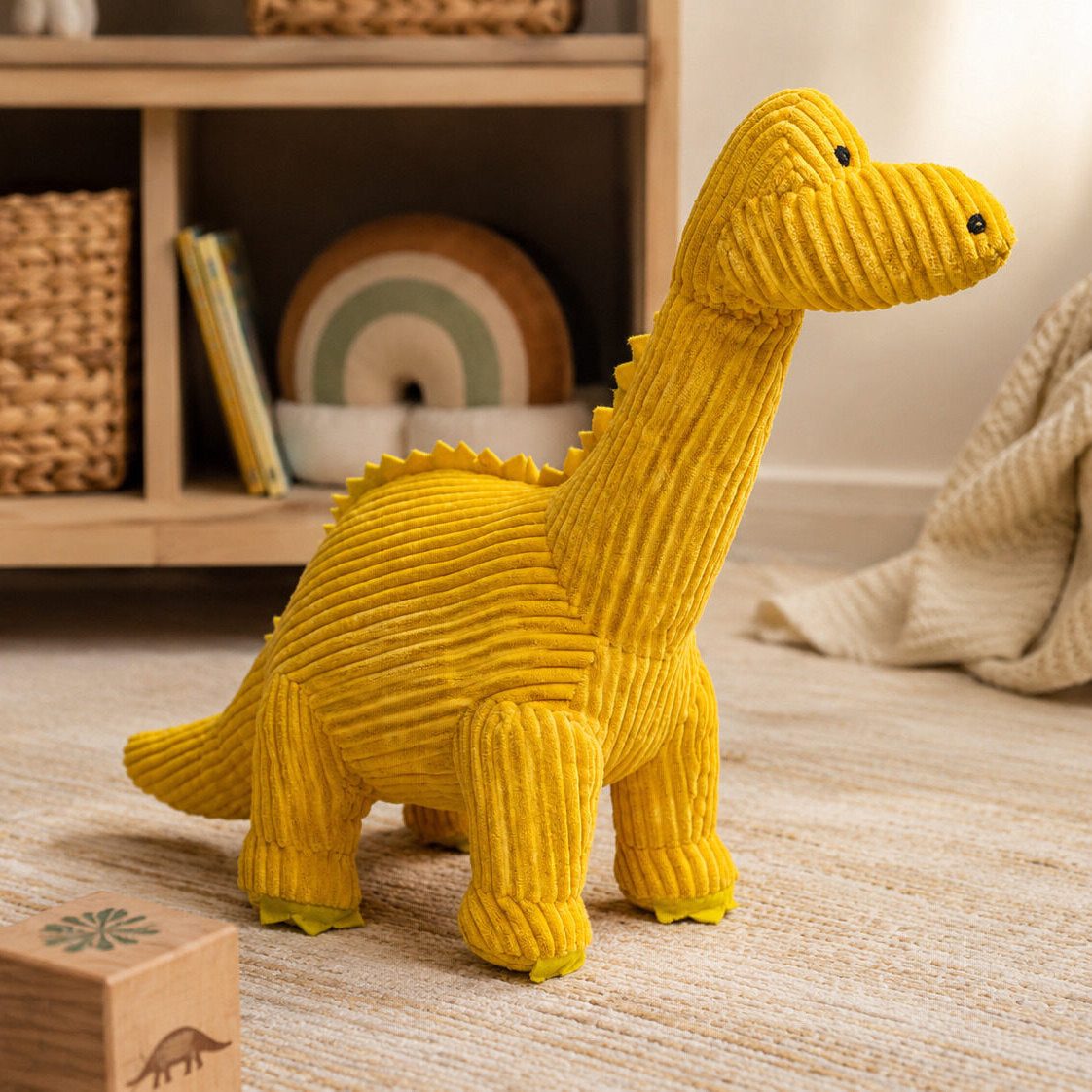 Yellow corduroy diplodocus dinosaur soft toy with long neck