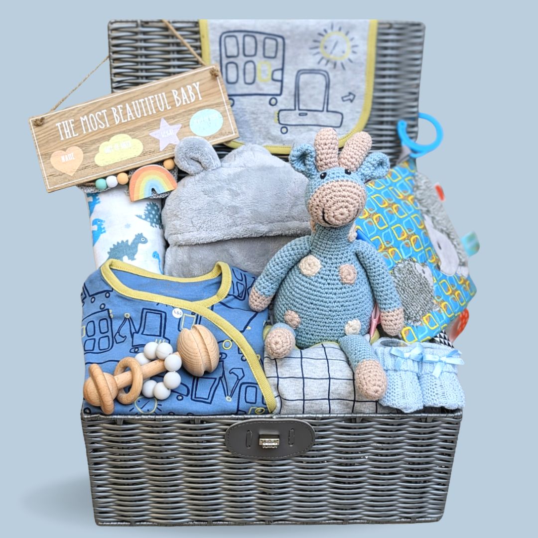 Baby boy hamper gift with organic clothing, organic giraffe, bath robe, teething toys and nursery plaque.