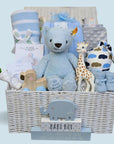 Baby boy hamper basket with teddy, blanket, toys, sophie la giraffe, baby hat and silver bracelet.