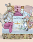 Baby girl hamper basket with flopsy bunny comforter and rattle. Also includes blanket, book, money box and hat.