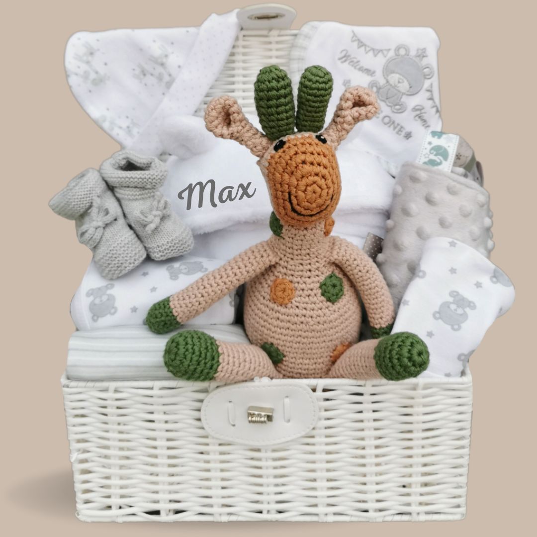 Baby hamper basket with bath robe, white baby clothes set, organic giraffe soft toy and blanket.