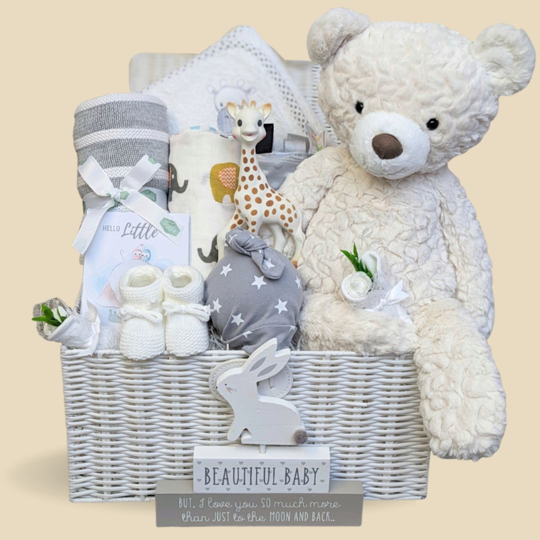 Stunning new baby hamper gift with giraffe theme. Comes complete with giraffe toy, chocolates, baby bib and hat and towel. The perfect gift.