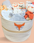 Baby hamper basket with woodland theme. Includes fox comforter, bath robe, blanket, muslin and baby booties.