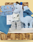 Baby boy hamper gift basket. Gifts include blue dinosaur and congratulations chocolates.