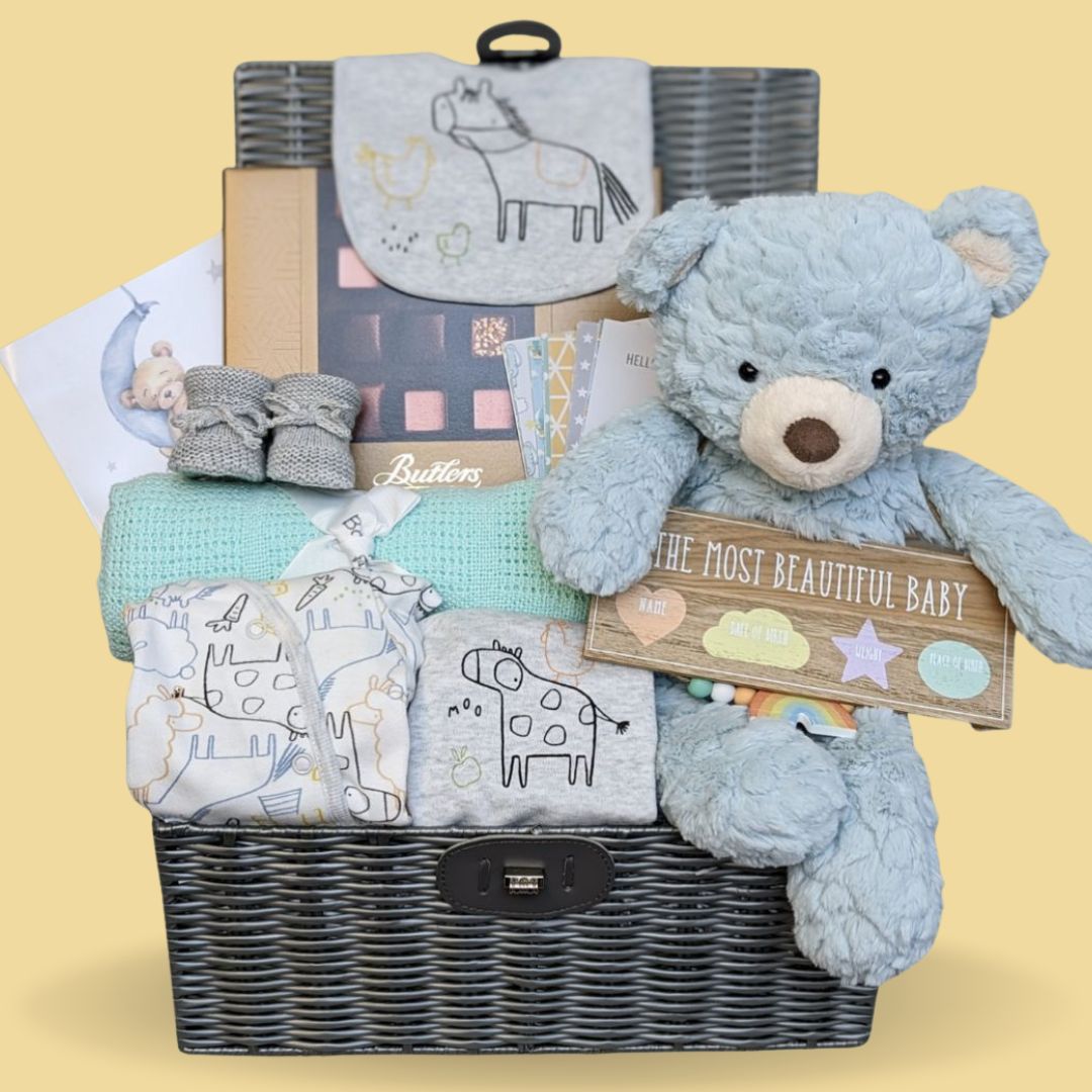 Baby boy hamper gift with clothing, teddy, chocolates and baby blanket.