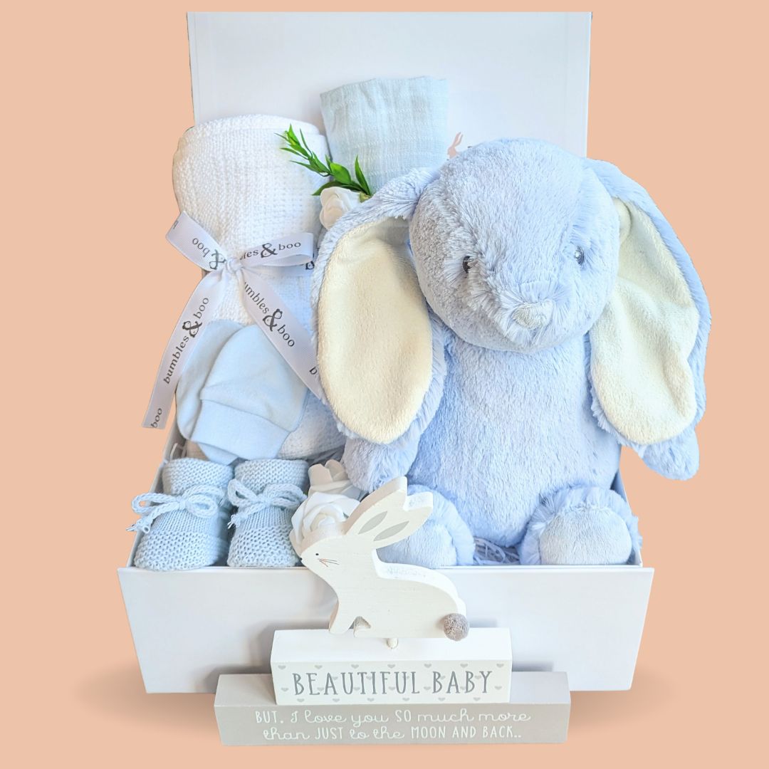 Baby boy gifts hamper with bunny, blanket, muslin wrap, baby booties and scratch mittens.
