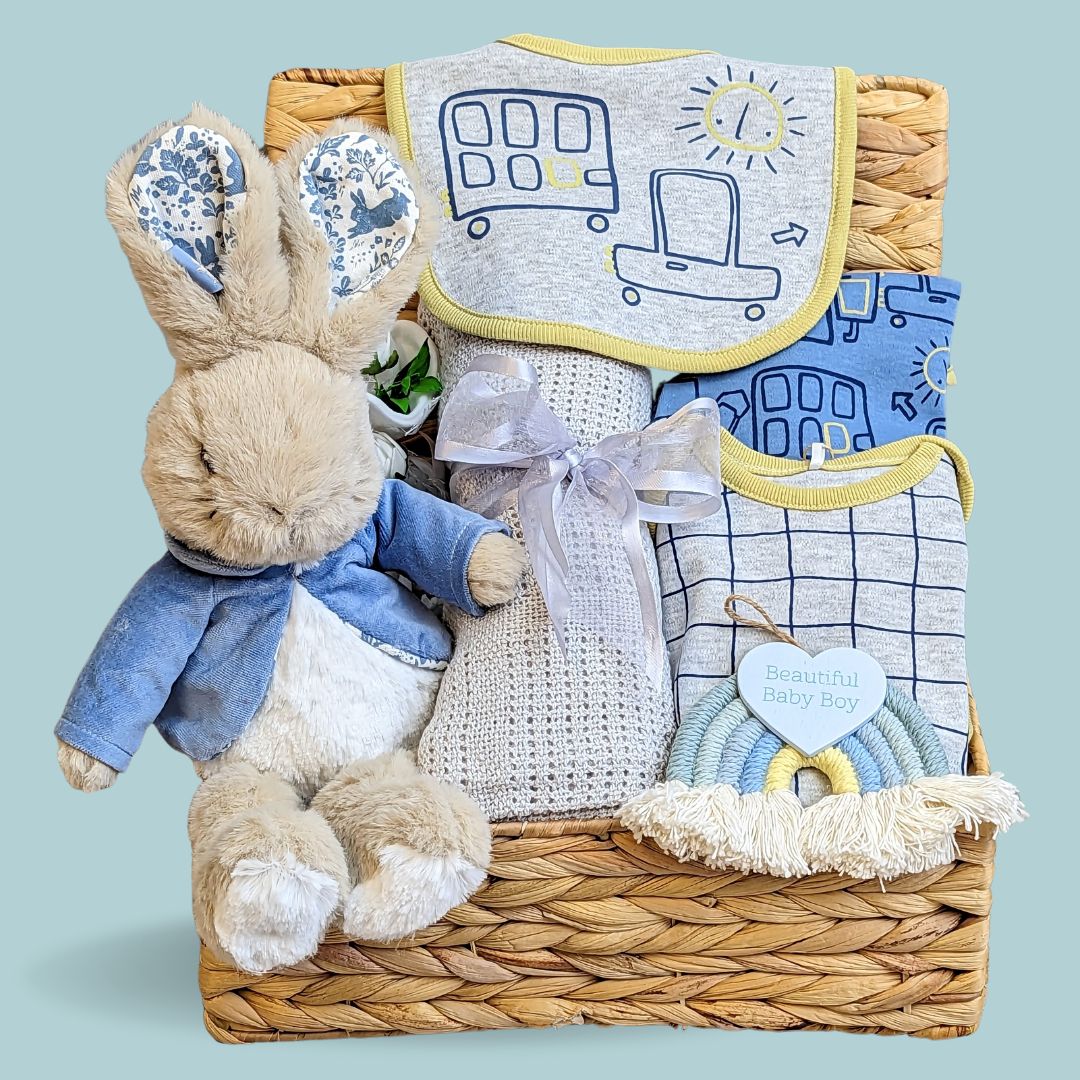 Baby boy hamper gift with peter rabbit soft toy and clothing set.