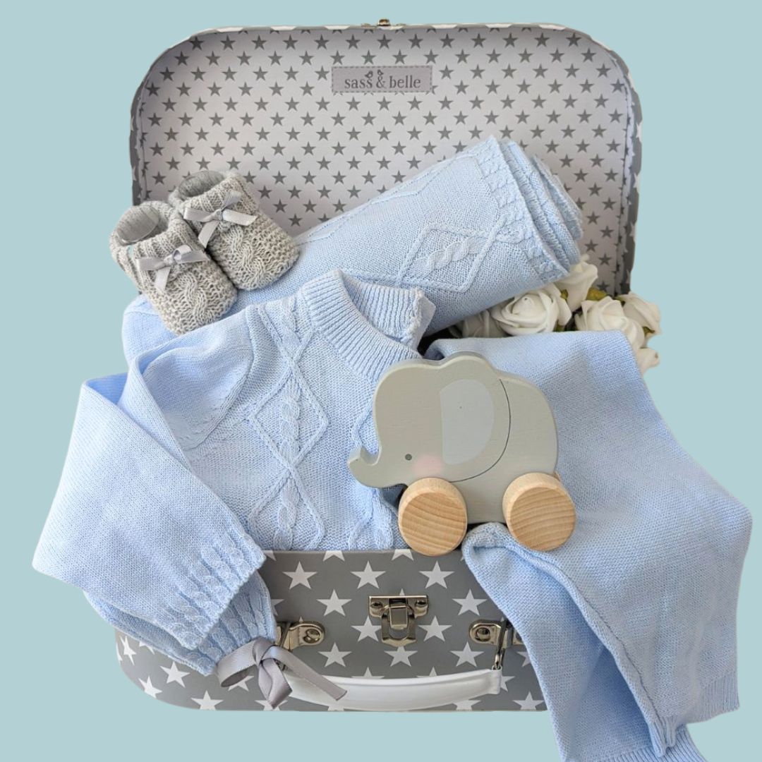 Baby boy hamper gift with  baby boy clothing set, baby booties and toy.