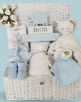 Baby Boy gifts hamper with white elephant comforter and white cellular balnket in a basket.