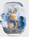 baby boy hamper gift with peter rabbit rattle, baby booties, baby hat and baby milestone cards.