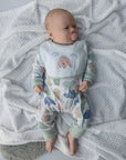 baby wearing sleepsuit and bib organic baby clothes set.