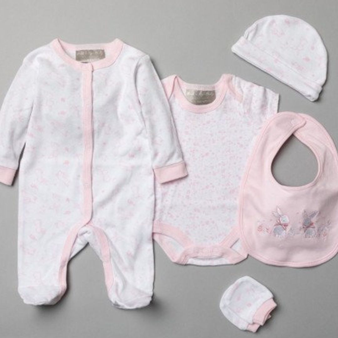 pink clothing set for a baby with bunnies.