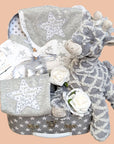 New baby gifts hamper with star baby clothes and grey giraffe.