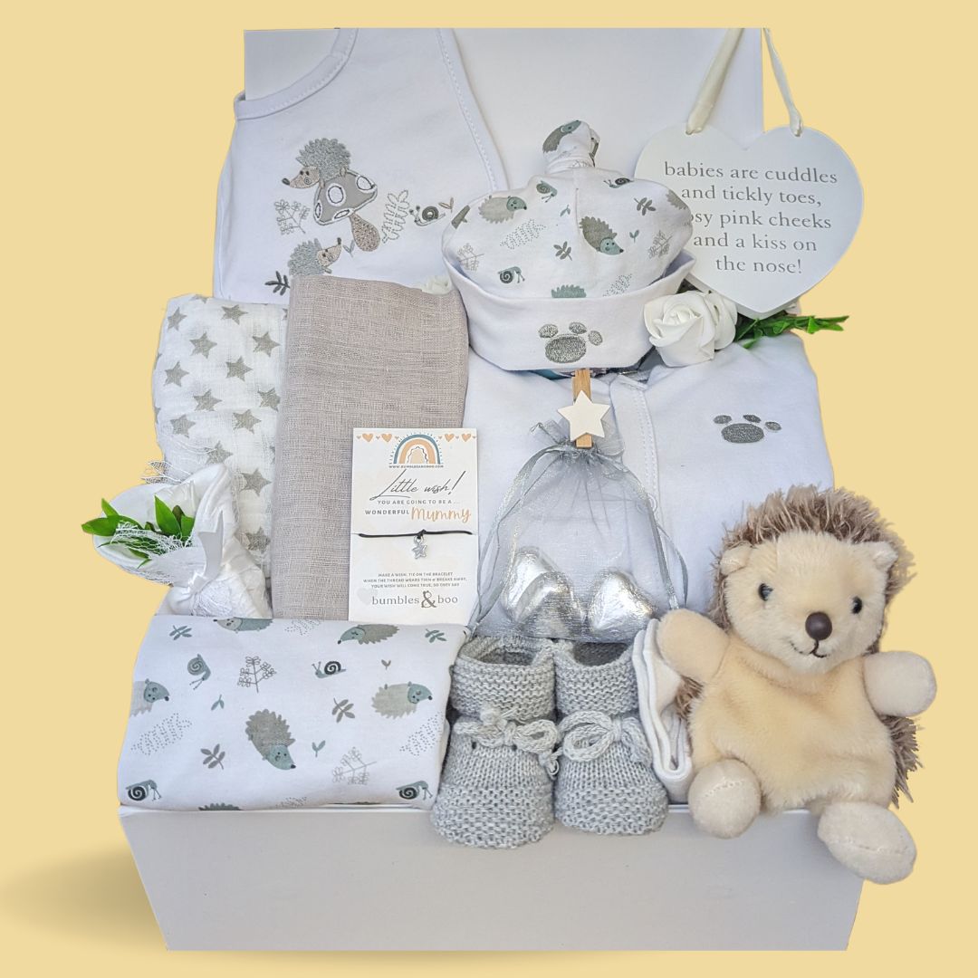 new baby hamper box to include clothing set, giraffe rattle, hanging plaque, muslin wrap, bracelet and chocolates.