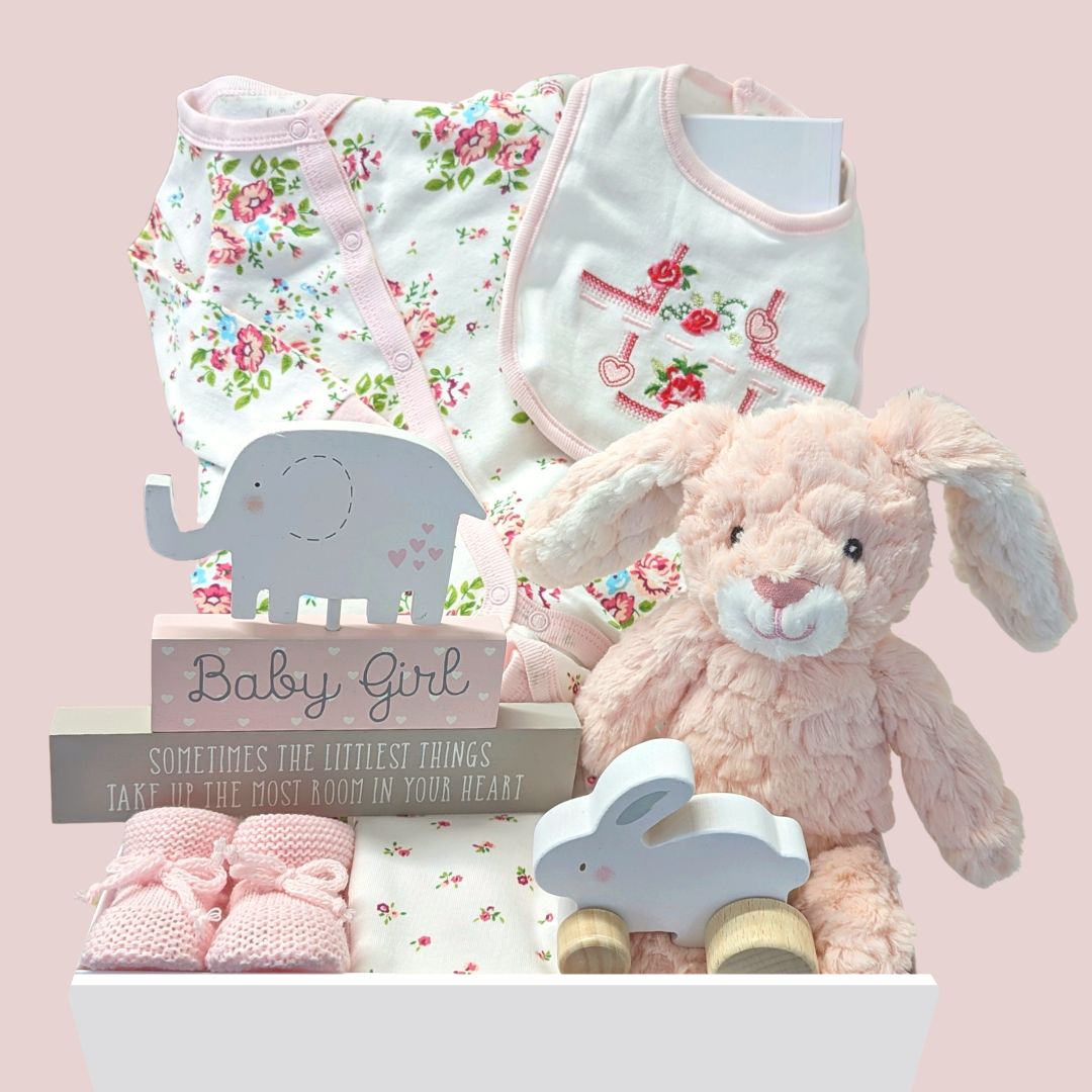 baby girl gifts box with clothing, bunny soft toy, baby booties and nursery plaque.
