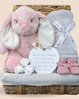 Baby girl hamper gifts with bunny, blanket, muslin wrap and baby booties.