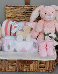 Baby girl hamper basket - gifts include pink bunny, pink stripes blanket and muslins.