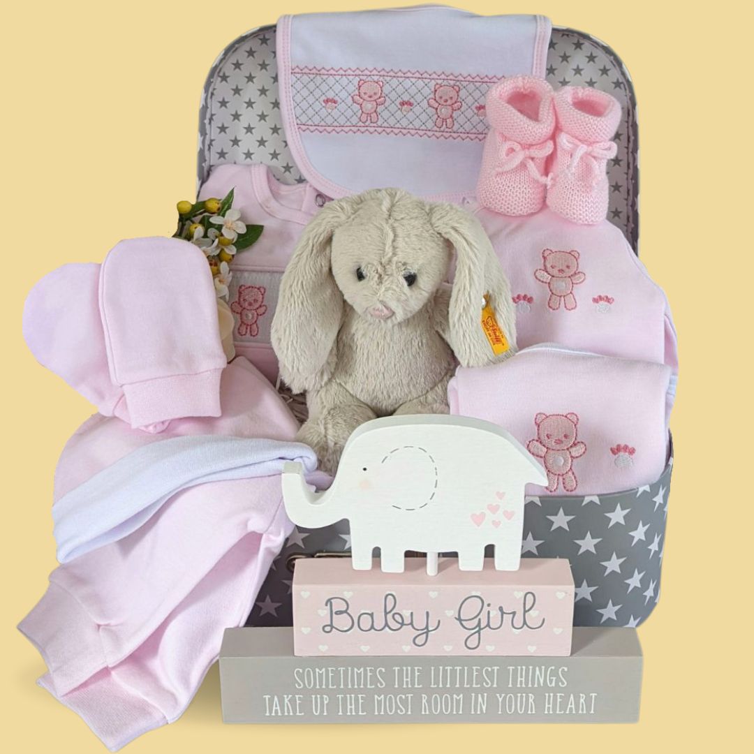 Baby girl hamper gift with clothing set, steiff bunny rabbit and baby booties.