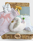 New Mum and Baby girl hamper basket with wool blanket, chocolates for the parents and gifts for baby.