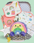 Baby girl hamper gift with clothing set, rainbow soft toy, bracelet for mum and hanging plaque.