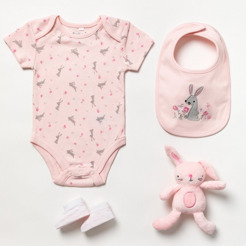 A four piece pink clothing and toy gift set in a luxury box with gift tag.  The set features bunny rabbit print in pink tones and each set contains  Short sleeved body suite  Booties  Bib  Bunny Rabbit Toy  A perfect new baby gift