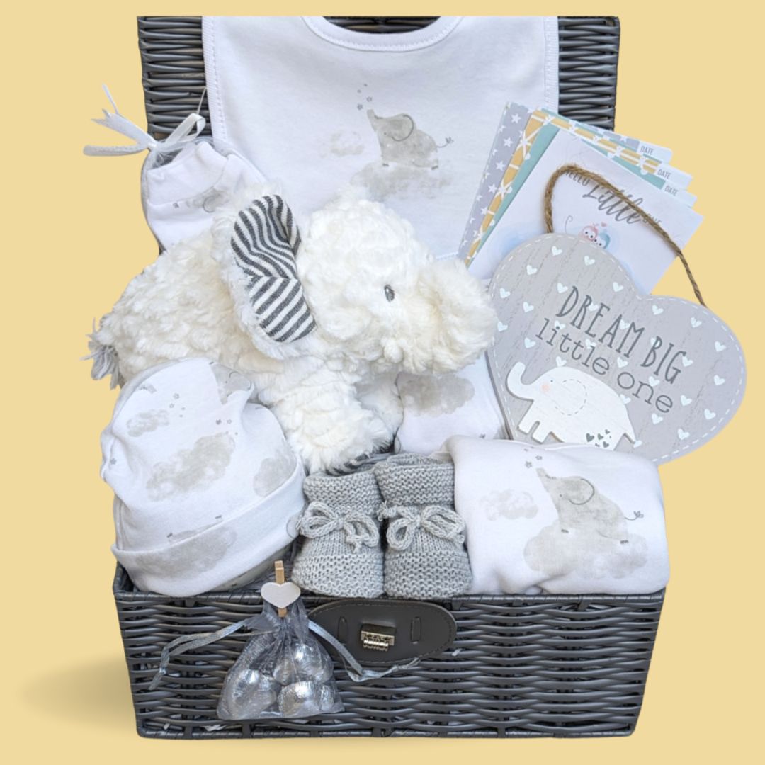 Unisex baby hamper with clothing set, elephant soft toy, baby booties, nursery plaque and milestone cards.