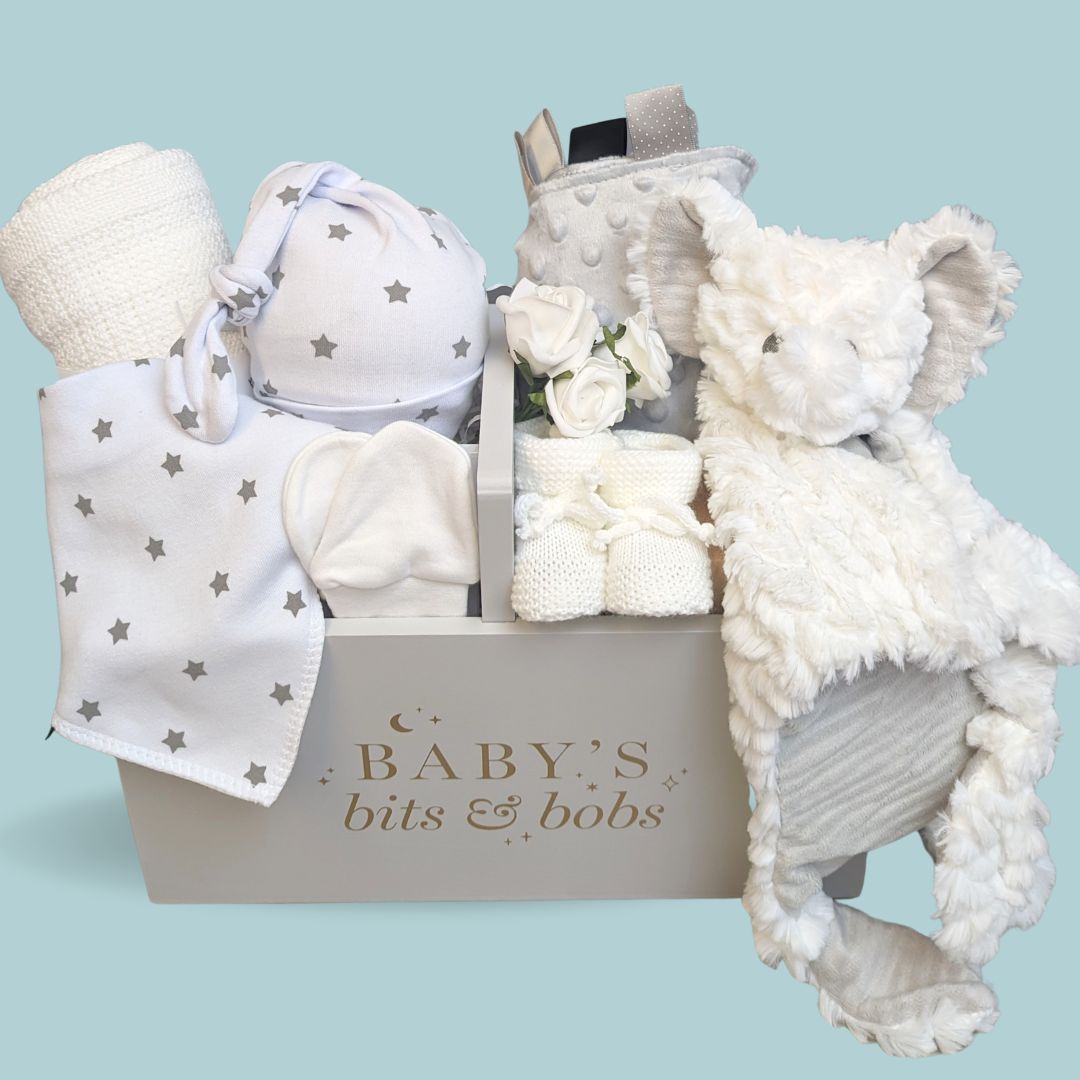 baby hamper gift with baby blanket, baby mittens, baby hat, taggie blanket.