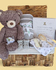 New baby hamper gift with large teddy bear, blanket and photo album.