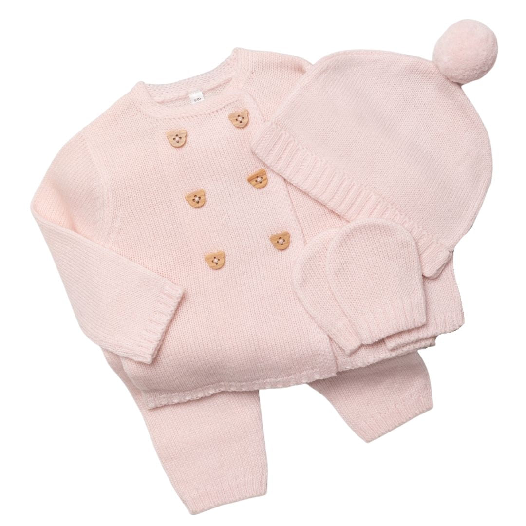 Soft knitted pink clothing gift set which includes Buttoned Long Sleeve, Top Long Trousers, Pompom Hat and Mittens