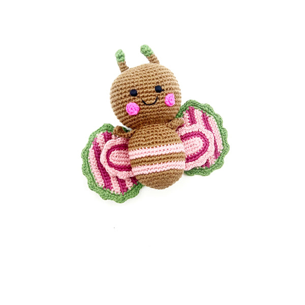 Knitted baby rattle in the shape of a butterfly with pink stripes.