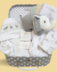 baby shower hamper gifts with white clothing set, & stripy elephant baby rattle.