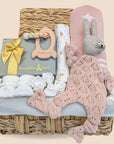 Stunning baby shower hamper which comprises organic muslin wrap, soft knit comforter, baby booties, blanket, rocket teether & delicious chocolates for the mum to be.