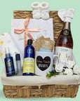Baby shower gifts hamper with treats for mum to be and also treats for baby. Includes chocolates and organic skincare.