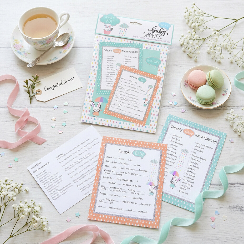 Baby Karaoke and Celebrity Baby Name Match Up sheets with pastel packaging displayed on a baby shower table.